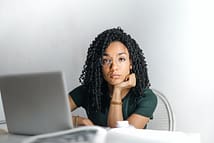women on computer checkign her email